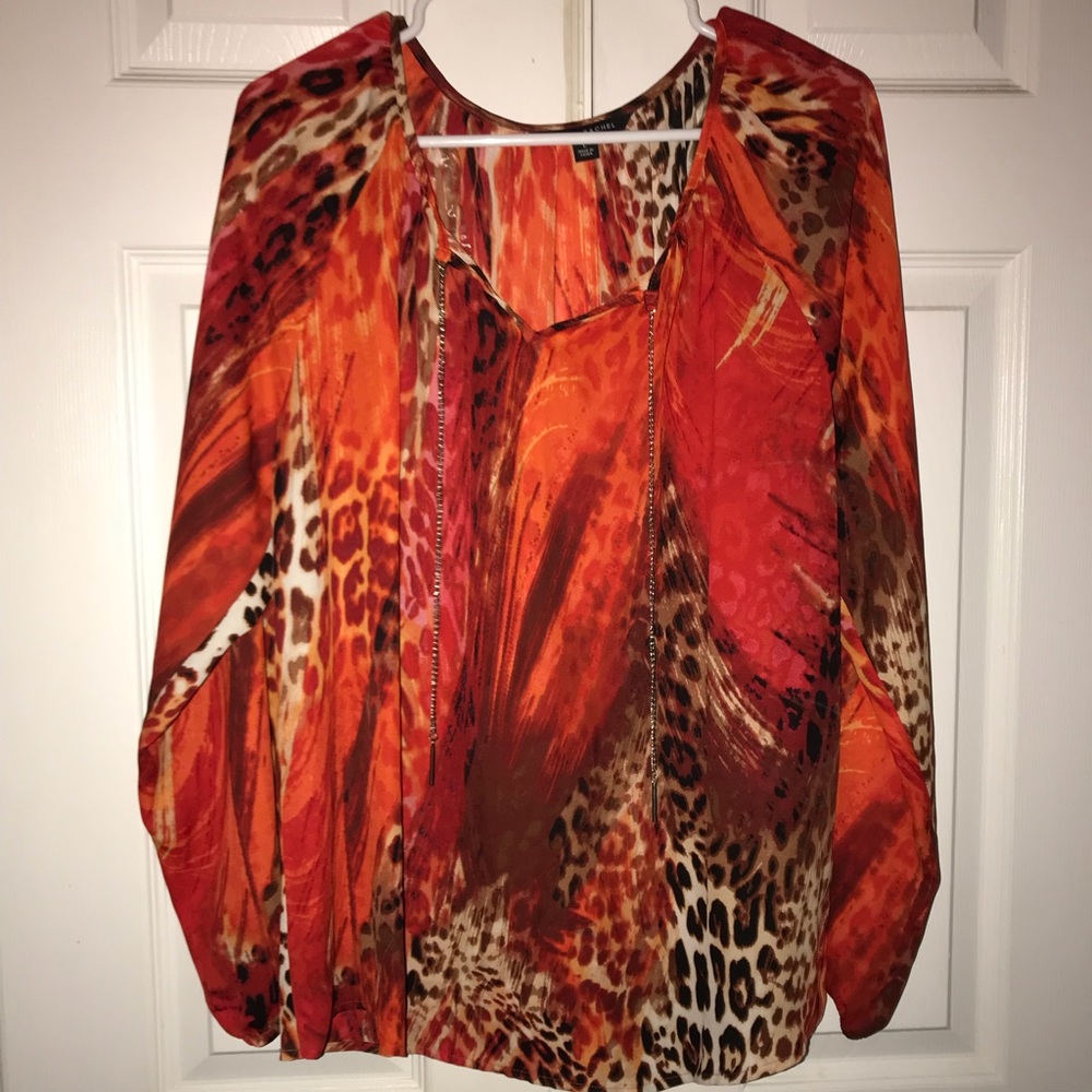 Very pretty multi colored shirt size L. Never worn